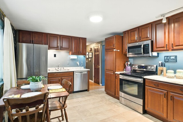 95 Lauter Ave, Windham, CT 06226 - kitchen with appliances with stainless steel finishes and light stone counters