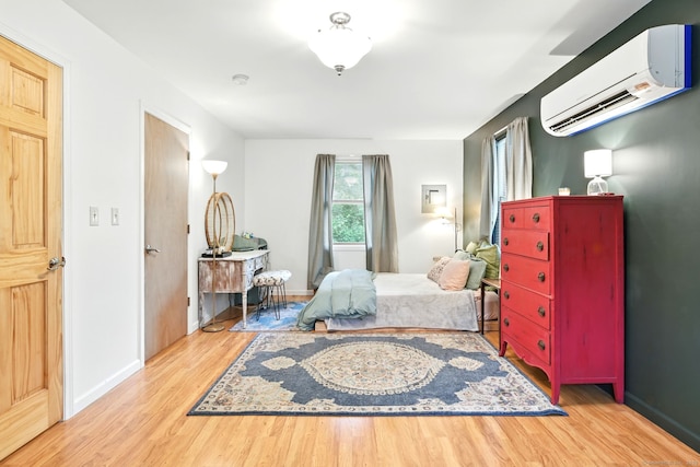 95 Lauter Ave, Windham, CT 06226 - bedroom with a wall mounted AC and wood finished floors