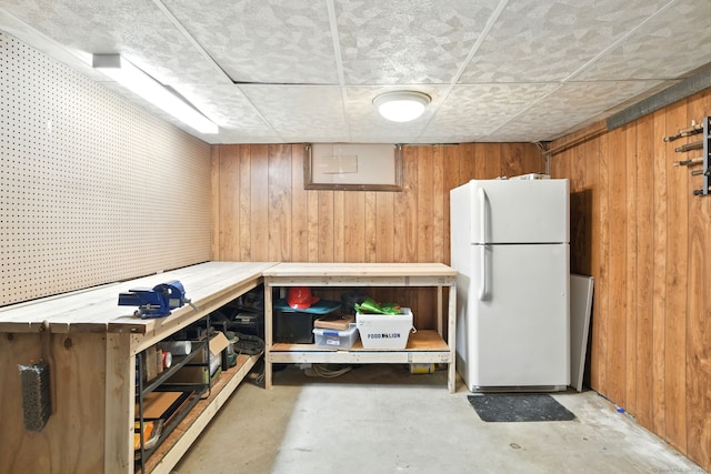 95 Lauter Ave, Windham, CT 06226 - finished below grade area featuring freestanding refrigerator, wood walls, and a workshop area