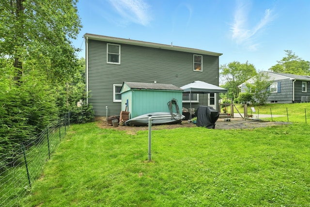 95 Lauter Ave, Windham, CT 06226 - back of property with a gazebo, a fenced backyard, and a patio area