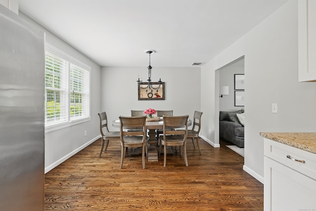 197 Webb Rd, Naugatuck, CT 06770 - dining space with dark wood-style floors, a chandelier, and baseboards