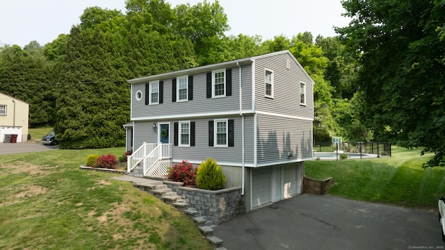 197 Webb Rd, Naugatuck, CT 06770 - view of front of house with driveway, an attached garage, and a front lawn