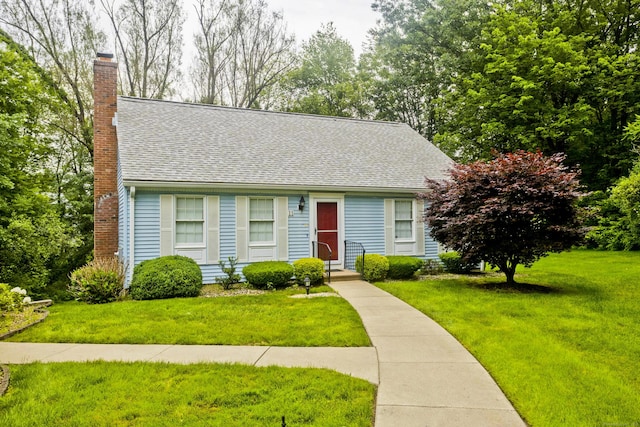11 Oxford Dr Unit 11, Suffield, CT 06078 - cape cod home featuring a chimney, roof with shingles, and a front yard