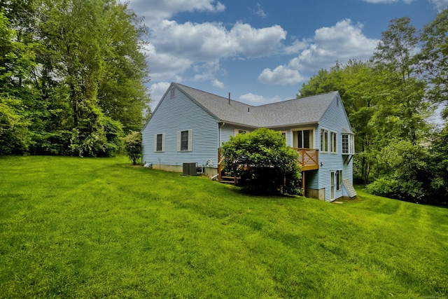 11 Oxford Dr Unit 11, Suffield, CT 06078 - back of property featuring a yard, a shingled roof, and a wooden deck