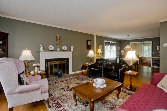 11 Oxford Dr Unit 11, Suffield, CT 06078 - living room featuring a fireplace with flush hearth, wood finished floors, and ornamental molding