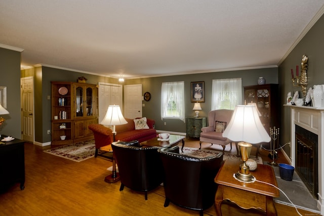 11 Oxford Dr Unit 11, Suffield, CT 06078 - living area featuring crown molding, wood finished floors, and a fireplace with flush hearth