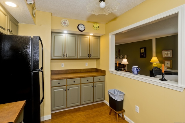 11 Oxford Dr Unit 11, Suffield, CT 06078 - kitchen with freestanding refrigerator, wood finished floors, and gray cabinetry