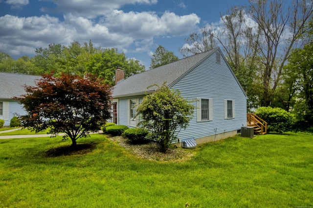 11 Oxford Dr Unit 11, Suffield, CT 06078 - view of side of home with a chimney, a lawn, and a shingled roof