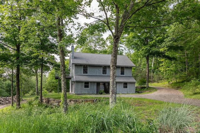 178 Carter Rd, Kent, CT 06754 - view of front facade with a shingled roof, a chimney, and asphalt driveway