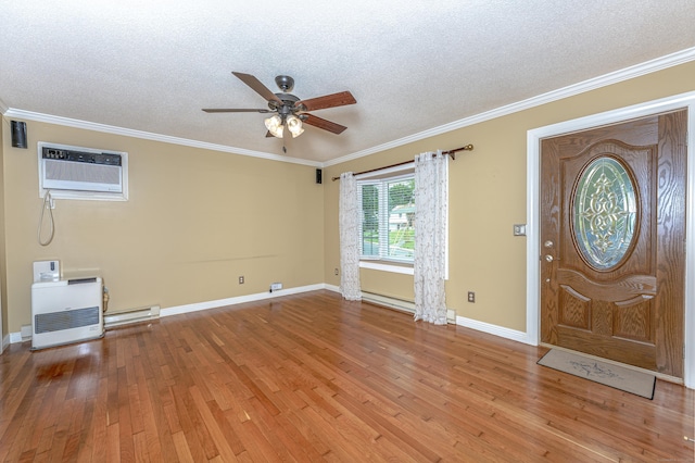 30 Lewis Rd, Bristol, CT 06010 - entryway featuring ceiling fan, a textured ceiling, hardwood / wood-style floors, a wall mounted AC, and a baseboard radiator