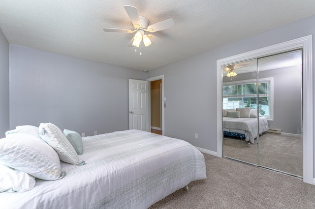 30 Lewis Rd, Bristol, CT 06010 - carpeted bedroom featuring a closet, ceiling fan, a baseboard heating unit, and a textured ceiling