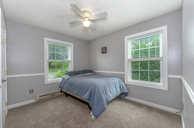 30 Lewis Rd, Bristol, CT 06010 - carpeted bedroom with baseboard heating, multiple windows, and ceiling fan