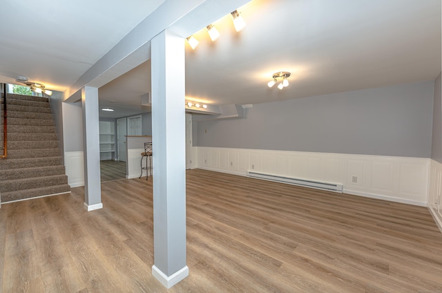 30 Lewis Rd, Bristol, CT 06010 - finished below grade area featuring baseboard heating, wood finished floors, stairs, and wainscoting