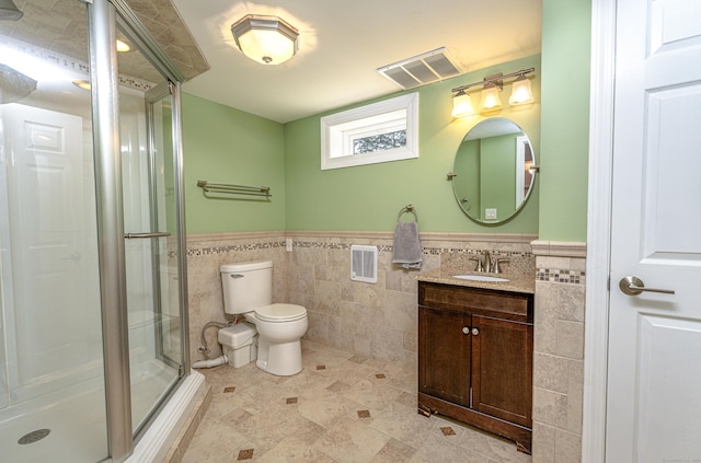 30 Lewis Rd, Bristol, CT 06010 - bathroom featuring tile walls, vanity, a stall shower, and wainscoting