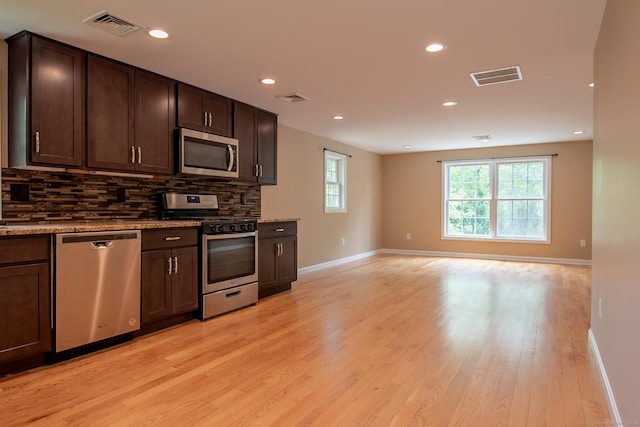 11 Breaults Landing Rd, Thompson, CT 06277 - kitchen featuring stainless steel appliances, backsplash, dark brown cabinetry, light wood finished floors, and recessed lighting