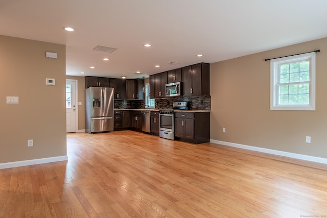 11 Breaults Landing Rd, Thompson, CT 06277 - kitchen featuring stainless steel appliances, dark brown cabinets, backsplash, light wood finished floors, and recessed lighting