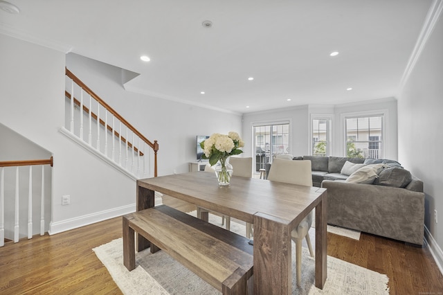 85 Camp Ave Apt 11J, Stamford, CT 06907 - dining room with ornamental molding, stairway, wood finished floors, and recessed lighting