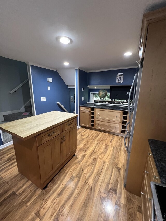 51 Brook St Apt 3C, Naugatuck, CT 06770 - kitchen with wood counters, light wood-type flooring, a kitchen island, brown cabinets, and recessed lighting
