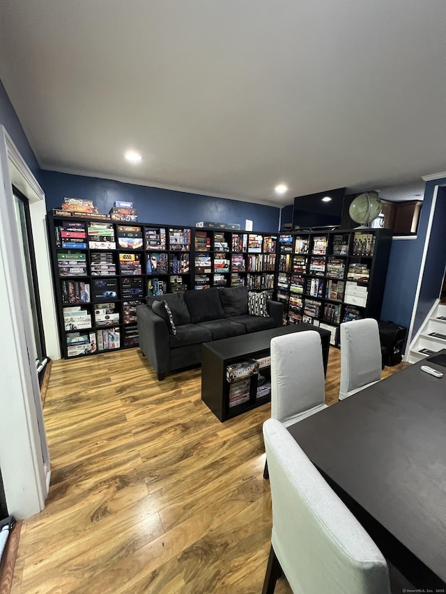 51 Brook St Apt 3C, Naugatuck, CT 06770 - living area featuring wood finished floors, bookshelves, and recessed lighting