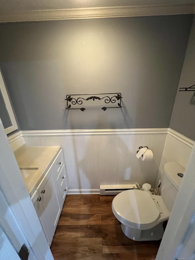 51 Brook St Apt 3C, Naugatuck, CT 06770 - half bathroom featuring vanity, wainscoting, toilet, wood finished floors, and crown molding
