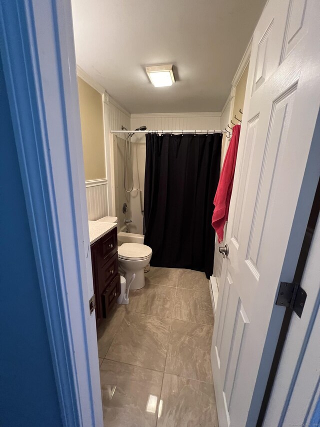 51 Brook St Apt 3C, Naugatuck, CT 06770 - bathroom with toilet, vanity, a wainscoted wall, and shower / bath combination with curtain