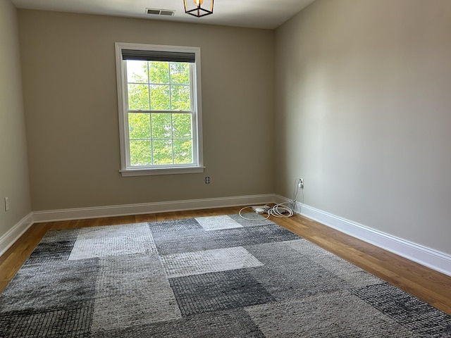 756 Hart St, Bridgeport, CT 06606 - spare room with wood finished floors and baseboards