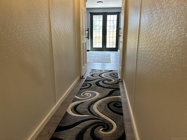 756 Hart St, Bridgeport, CT 06606 - hallway with inlaid floor details, french doors, and a textured wall