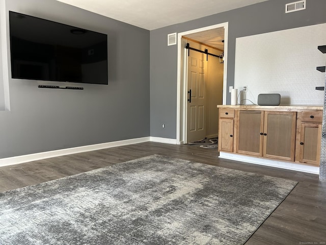 756 Hart St, Bridgeport, CT 06606 - living area featuring a barn door and dark wood-type flooring