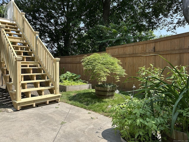 756 Hart St, Bridgeport, CT 06606 - fenced backyard featuring stairs and a patio