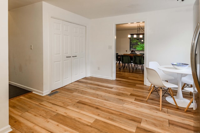 11 Wood Duck Ln Unit 11, Simsbury, CT 06081 - dining area with light wood finished floors and a chandelier