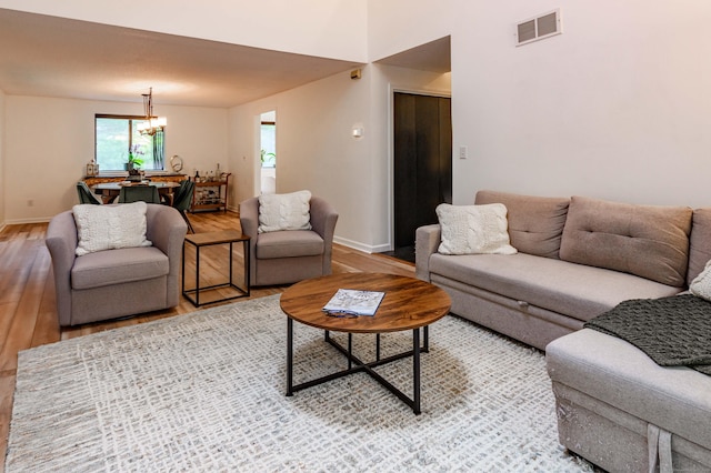 11 Wood Duck Ln Unit 11, Simsbury, CT 06081 - living room with light wood-style floors and a chandelier