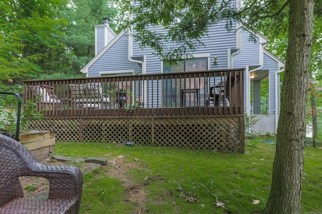 11 Wood Duck Ln Unit 11, Simsbury, CT 06081 - rear view of house featuring a yard, a wooden deck, and a chimney