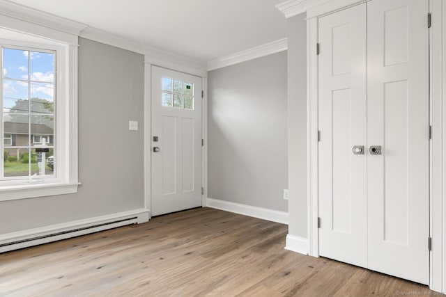 8 Edwards Rd, Old Saybrook, CT 06475 - entrance foyer with crown molding, light wood-type flooring, and a baseboard radiator
