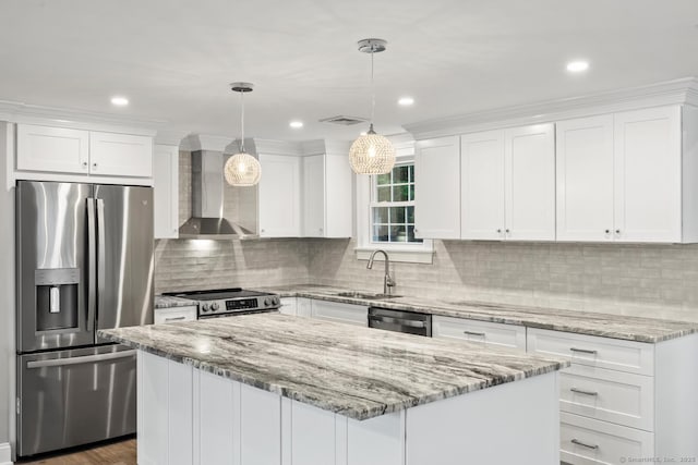 8 Edwards Rd, Old Saybrook, CT 06475 - kitchen featuring appliances with stainless steel finishes, wall chimney range hood, white cabinets, a kitchen island, and recessed lighting