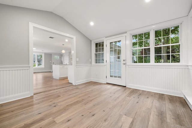 8 Edwards Rd, Old Saybrook, CT 06475 - spare room featuring a wainscoted wall, vaulted ceiling, light wood-style flooring, a baseboard radiator, and a decorative wall
