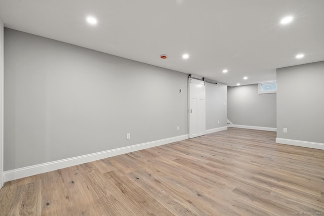 8 Edwards Rd, Old Saybrook, CT 06475 - below grade area with recessed lighting, light wood finished floors, and a barn door