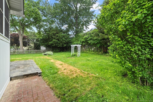 8 Edwards Rd, Old Saybrook, CT 06475 - fenced backyard with a patio and view of scattered trees