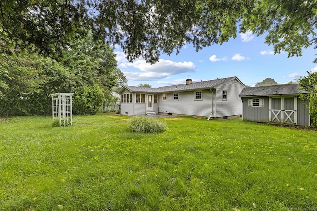 8 Edwards Rd, Old Saybrook, CT 06475 - back of property featuring a shed, a lawn, a chimney, and crawl space
