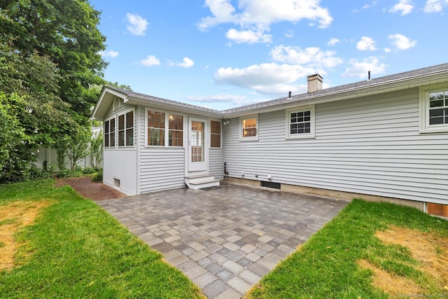 8 Edwards Rd, Old Saybrook, CT 06475 - rear view of house with entry steps, a patio area, a yard, and a chimney