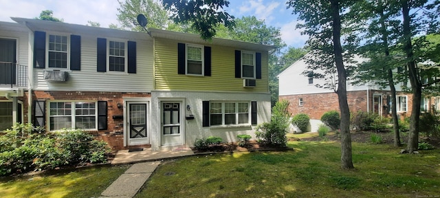 75 Hunter Ct Unit 75, Torrington, CT 06790 - townhome / multi-family property with brick siding and a front yard