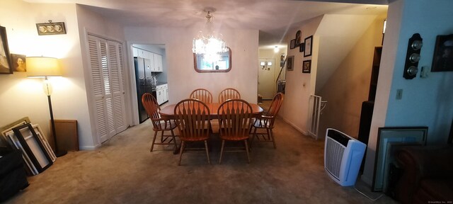 75 Hunter Ct Unit 75, Torrington, CT 06790 - dining room featuring light colored carpet and a chandelier