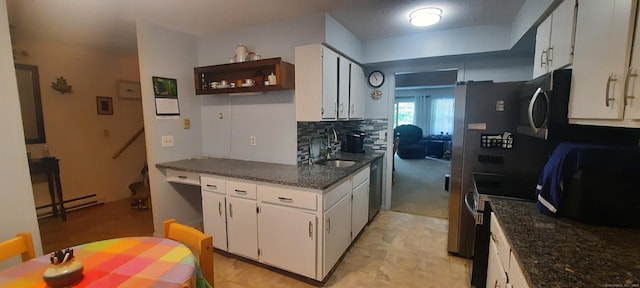 75 Hunter Ct Unit 75, Torrington, CT 06790 - kitchen with appliances with stainless steel finishes, white cabinetry, a baseboard radiator, decorative backsplash, and dark stone counters