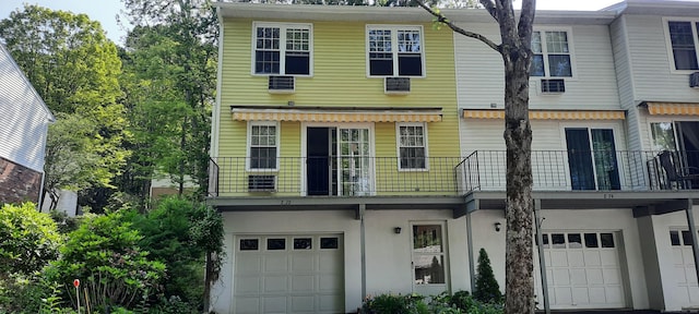 75 Hunter Ct Unit 75, Torrington, CT 06790 - townhome / multi-family property featuring a balcony, a garage, and stucco siding