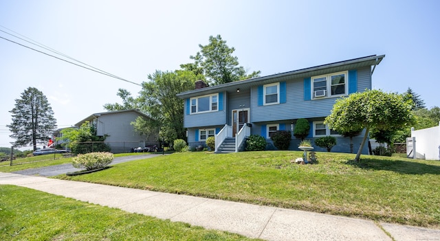 30 S Dale St, East Haven, CT 06513 - bi-level home with a chimney, a front yard, and cooling unit