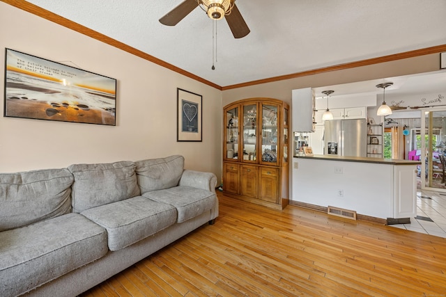 30 S Dale St, East Haven, CT 06513 - living area featuring ceiling fan, light wood finished floors, and ornamental molding