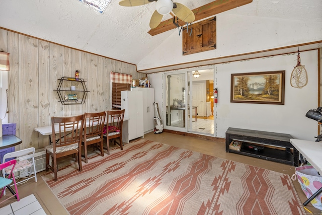 30 S Dale St, East Haven, CT 06513 - dining area with lofted ceiling, a textured ceiling, ceiling fan, and wood walls