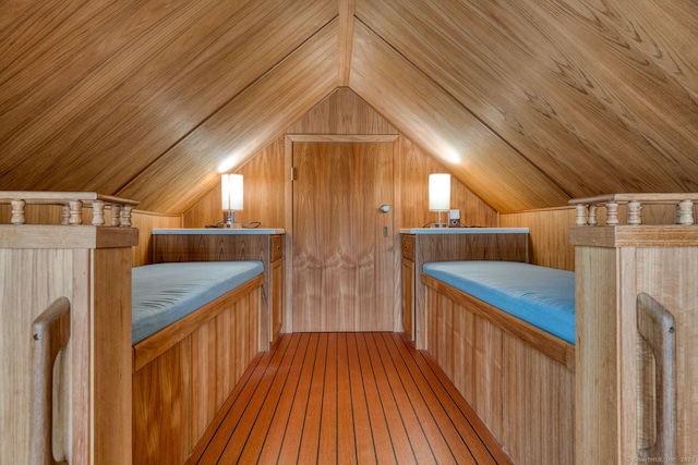 7 Crescent Ave, East Lyme, CT 06357 - unfurnished bedroom featuring vaulted ceiling, wooden walls, wood ceiling, and wood finished floors