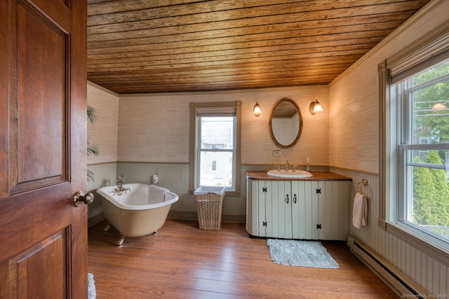 7 Crescent Ave, East Lyme, CT 06357 - bathroom with wooden ceiling, wallpapered walls, baseboard heating, vanity, and a soaking tub