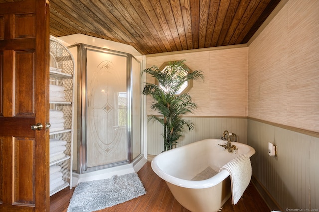 7 Crescent Ave, East Lyme, CT 06357 - bathroom featuring wooden ceiling, wainscoting, wood finished floors, a freestanding tub, and wallpapered walls