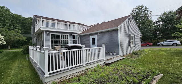 258 Eddy Glover Blvd, New Britain, CT 06053 - back of property with a balcony, a yard, and a wooden deck